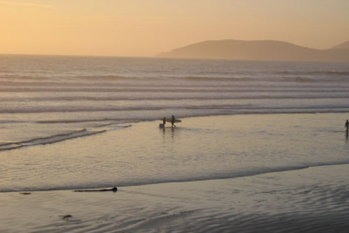 surfers at Pismo Beach, CA