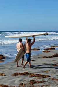 two surfers on beach