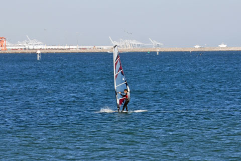 Windsurfer at Cabrillo Beach fishing pier, Los Angeles, CA
